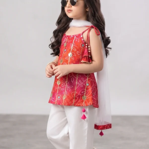 Little girl wearing an orange-pink gradient pure cotton festive kurti featuring rich Gota patti work, shoulder tassels, white pants with a Gota border, and a matching sheer dupatta.